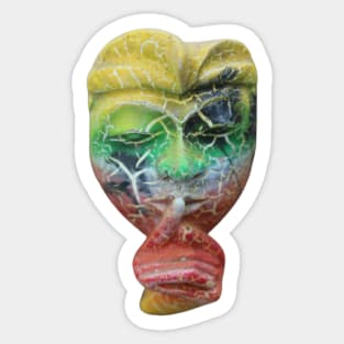 A Bali face mask cut out with finger on its mouth. Sticker